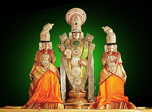 Lord Venkateswara Temple Deity with Consorts in Ornate Gold and Silk Attire HD wallpaper