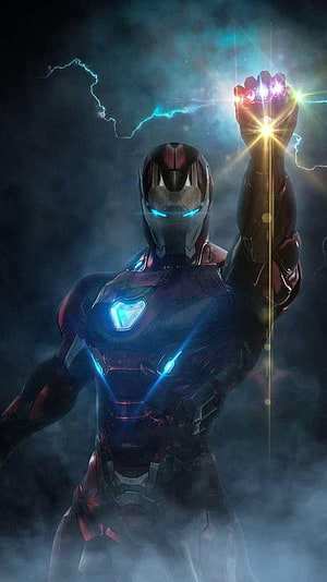 Iron Man Mark 85 Holding Infinity Gauntlet with Glowing Stones and Arc Reactor HD phone wallpaper
