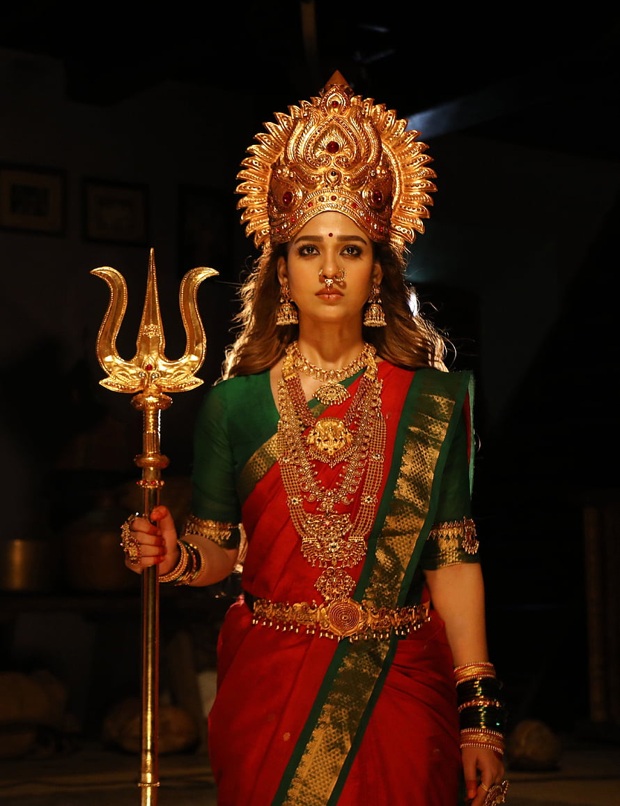 Mookuthi Amman Portrait in Traditional Red Saree with Golden Trishula and Ornate Headdress HD phone wallpaper