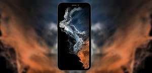Samsung Galaxy S22 Displaying Abstract Particle Wave Wallpaper on Dark Background HD wallpaper