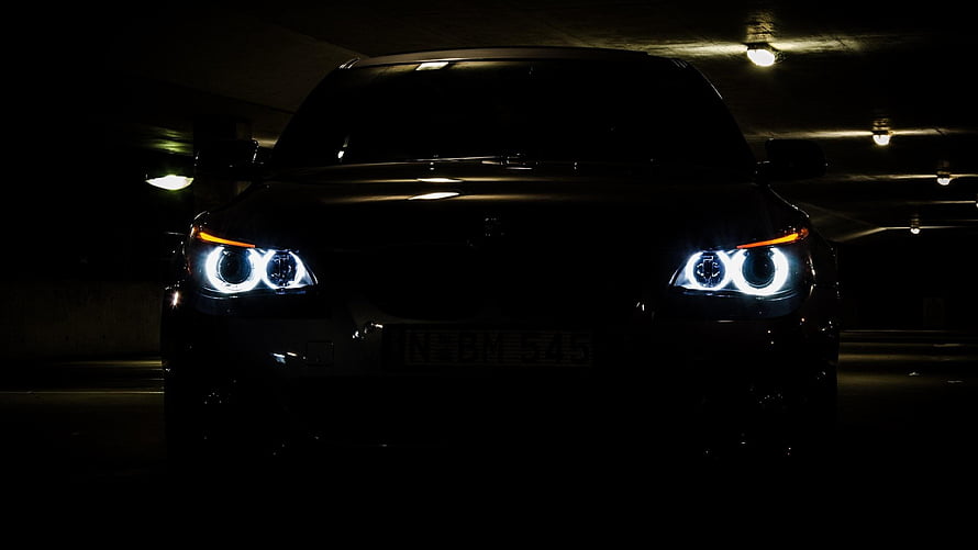 BMW M5 E60 Front Headlights in Dark Parking Garage HD wallpaper