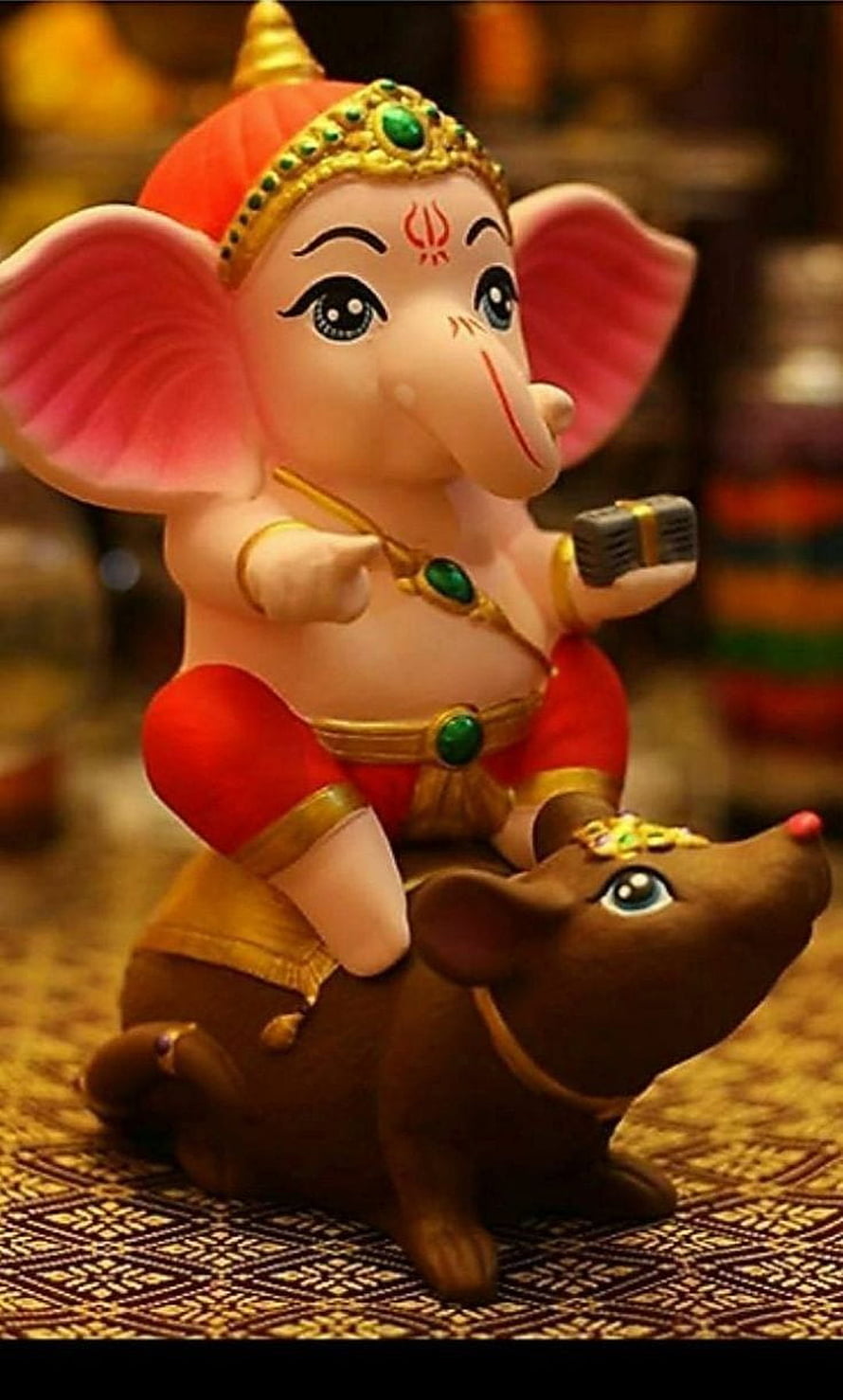 Cute Ganesha Idol Riding Mouse with Microphone and Traditional Jewelry HD phone wallpaper