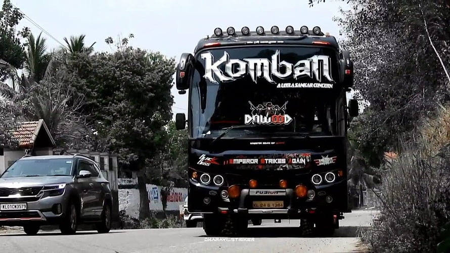Komban Dawood Tourist Bus Front View on a Suburban Road HD wallpaper