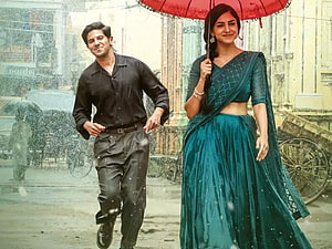 Sita Ramam Movie Still Featuring Dulquer Salmaan and Mrunal Thakur Walking in the Rain HD wallpaper