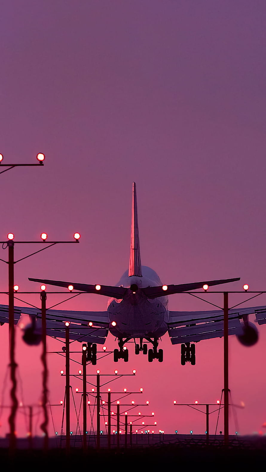 Commercial Jetliner Silhouette Approaching Runway at Dusk with Purple Sky HD phone wallpaper