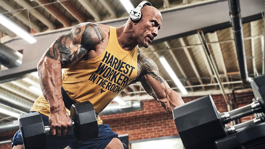 Dwayne Johnson Performing Dumbbell Row in Gym Wearing Yellow Tank Top HD wallpaper