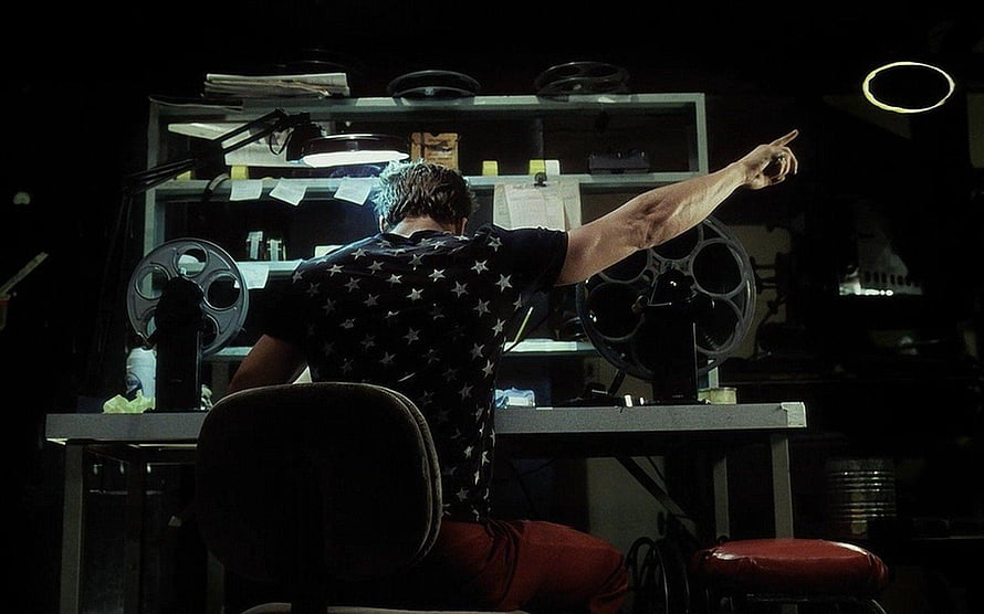 Fight Club Film Still: Man in Star Shirt at Film Editing Desk HD wallpaper