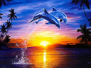 Two dolphins leaping through a vibrant tropical sunset with palm trees and ocean spray HD wallpaper