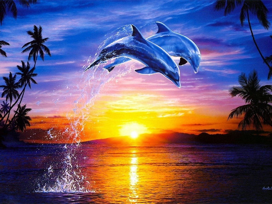 Two dolphins leaping through a vibrant tropical sunset with palm trees and ocean spray HD wallpaper