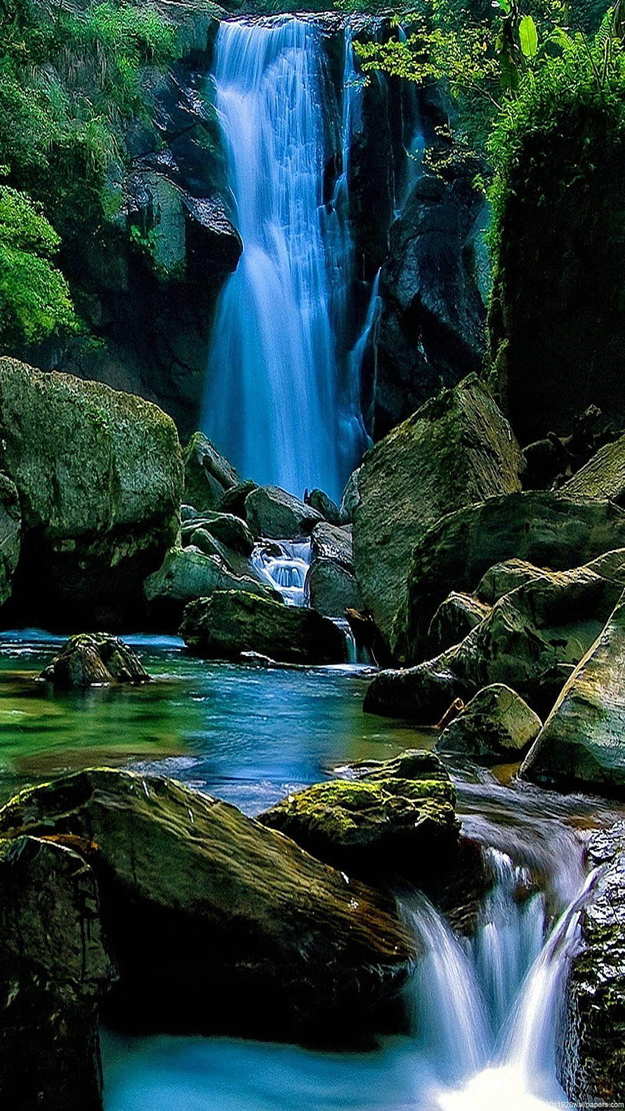 Mossy Forest Waterfall Tumbling Over Rocks Into a Turquoise Stream HD phone wallpaper