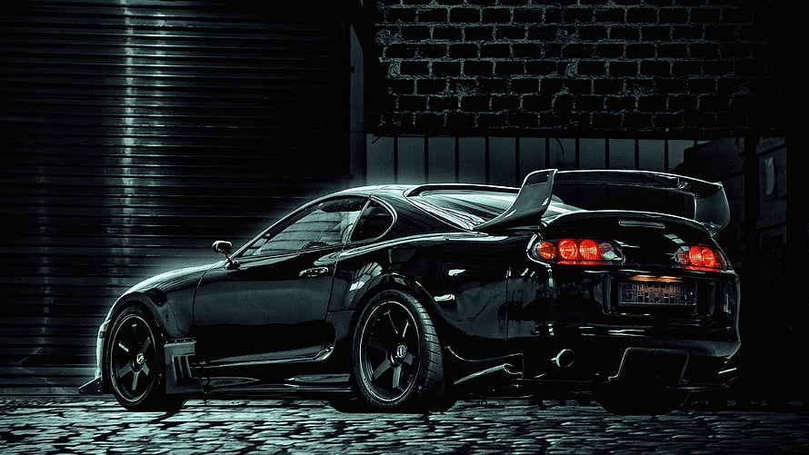Black Toyota Supra MK4 Rear Three-Quarter View in Dark Urban Setting HD wallpaper