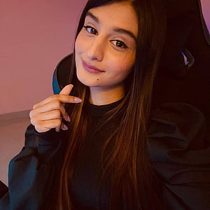 Payal Gaming Portrait in Black Hoodie with Soft Pink Background HD phone wallpaper