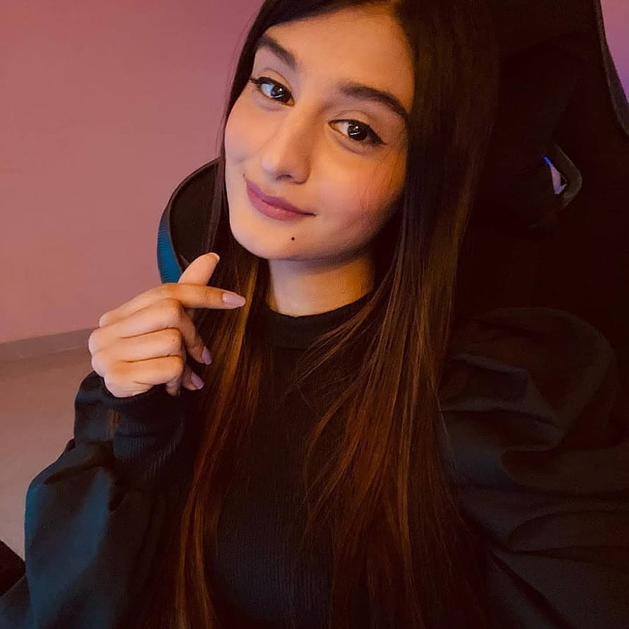 Payal Gaming Portrait in Black Hoodie with Soft Pink Background HD phone wallpaper