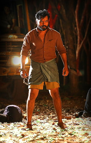 Kaithi Movie Still: Intense Action Scene with Handcuffed Protagonist in Nighttime Forest Setting HD phone wallpaper