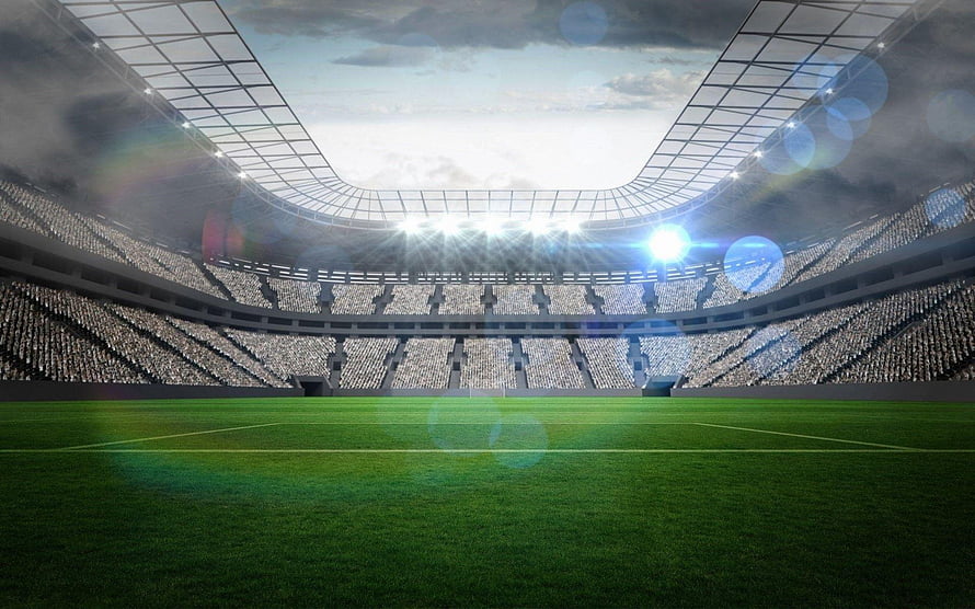 Vast Football Stadium Interior With Floodlights And Green Pitch HD wallpaper