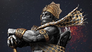 Hanuman in ornate golden armor and crown wielding a staff against a fiery dark background HD wallpaper