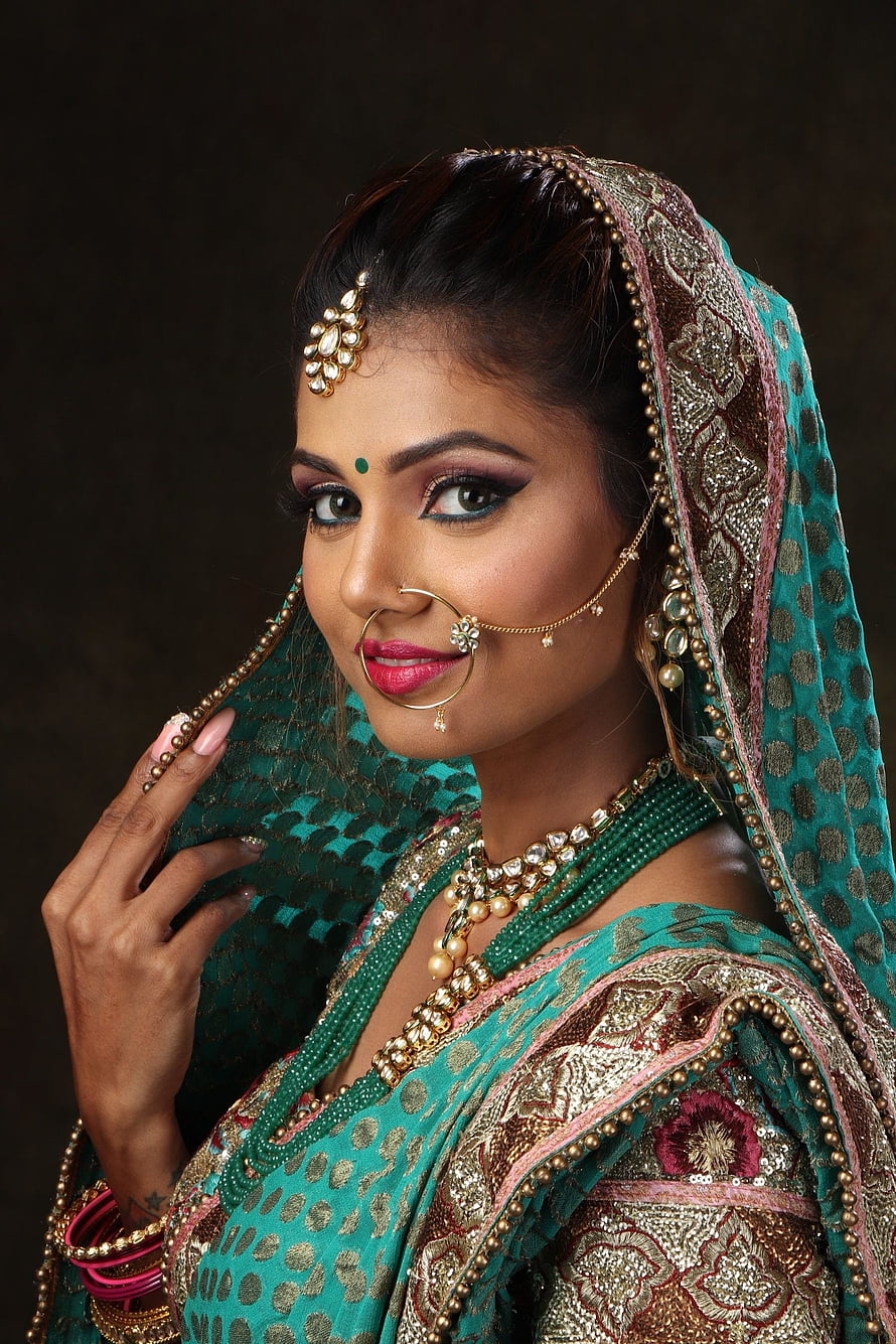 Elegant Indian Woman in Teal Saree with Gold Jewelry and Traditional Makeup HD phone wallpaper
