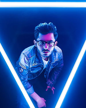 CarryMinati in Denim Jacket with Neon Blue Lighting and Geometric Frame HD phone wallpaper