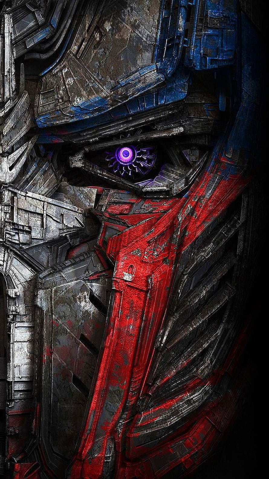 Optimus Prime Close-Up Portrait with Glowing Purple Eye and Weathered Red Armor HD phone wallpaper