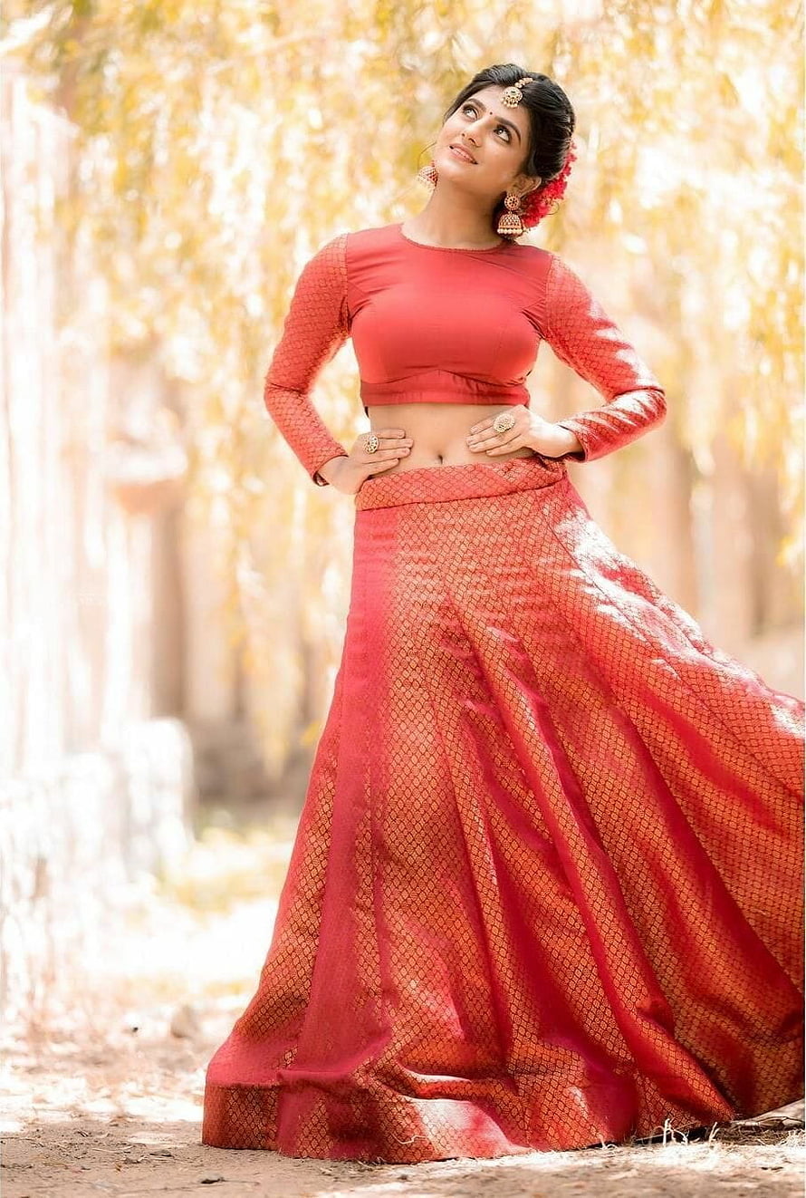 Gabriella Charlton in a red traditional lehenga with floral hair accessories HD phone wallpaper