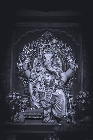 Ganesha Temple Idol Adorned With Floral Garlands In Dramatic Black And White HD phone wallpaper