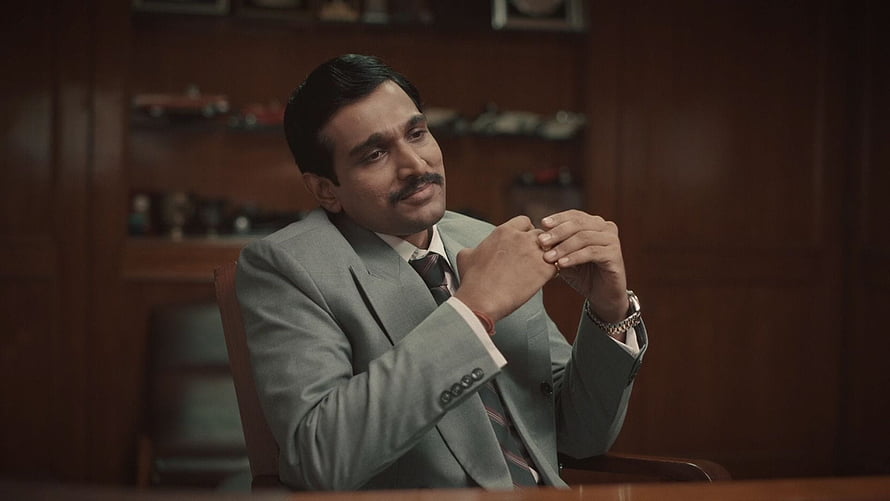 Scam 1992 The Harshad Mehta Story Character in Grey Suit Office Scene HD wallpaper