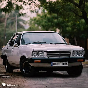 Classic White Hindustan Contessa Sedan Parked on a Tree-Lined Street HD phone wallpaper