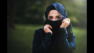 Elegant Woman in Black Hijab and Niqab with Soft Outdoor Portrait HD wallpaper