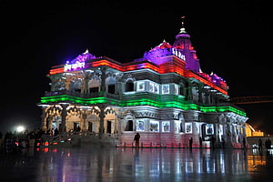 Prem Mandir Vrindavan Illuminated at Night with Vibrant Colored Lights HD wallpaper