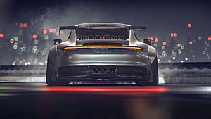 Rear View of a Silver Porsche 992 GT3 on a Night Track with Bokeh Lights HD wallpaper