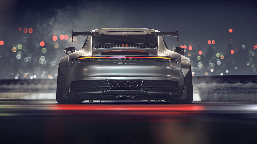 Rear View of a Silver Porsche 992 GT3 on a Night Track with Bokeh Lights HD wallpaper