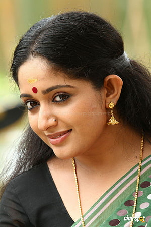 Kavya Madhavan in Green Saree with Traditional Gold Jewelry and Bindu HD phone wallpaper