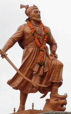 Sambhaji Maharaj Bronze Statue Holding Sword and Marigold Garland HD phone wallpaper