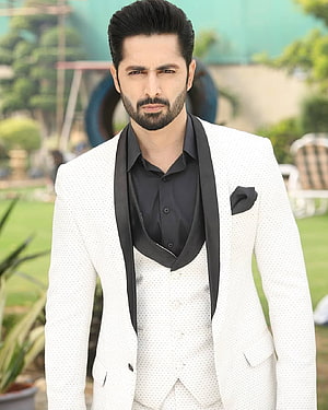 Danish Taimoor in a white textured three-piece suit with black satin lapels and pocket square HD phone wallpaper