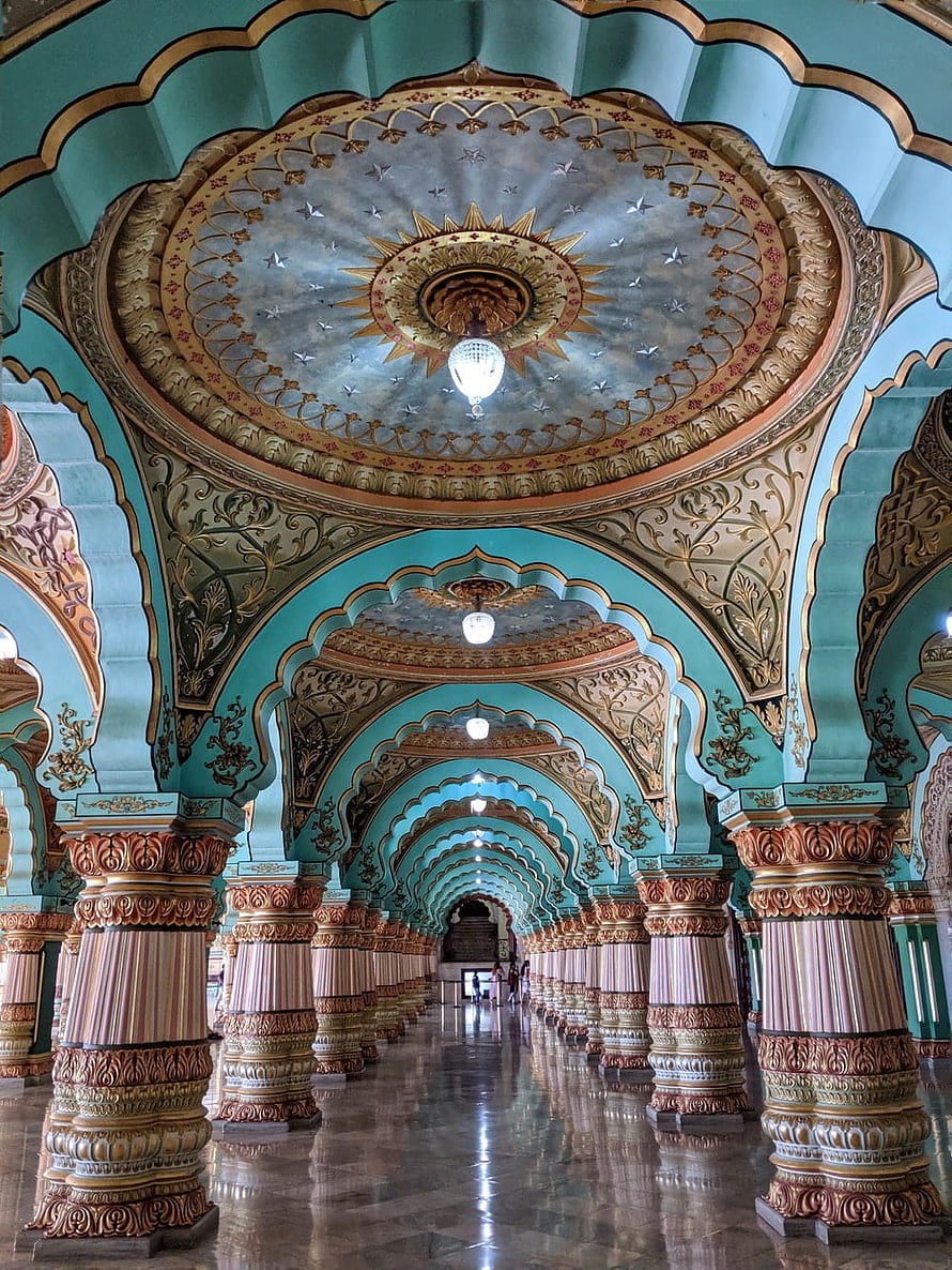 Ornate Indian Palace Corridor with Turquoise Arches and Intricate Gold Ceiling Details HD phone wallpaper
