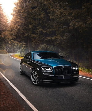 Rolls Royce Wraith in two-tone black and teal driving on a forest road at dusk HD phone wallpaper