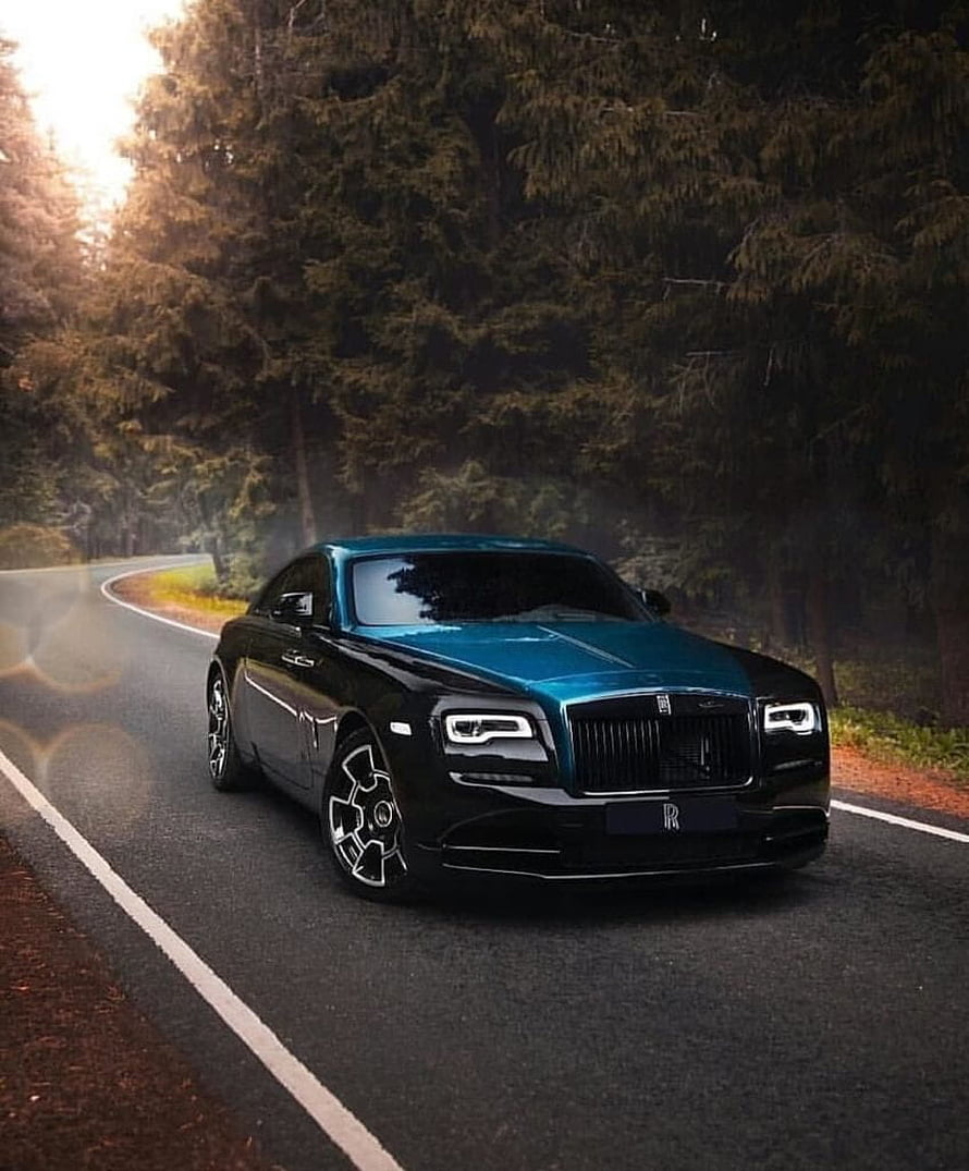 Rolls Royce Wraith in two-tone black and teal driving on a forest road at dusk HD phone wallpaper