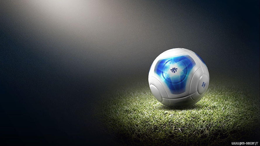 Pro Evolution Soccer Ball on Grass Under Dramatic Spotlight HD wallpaper
