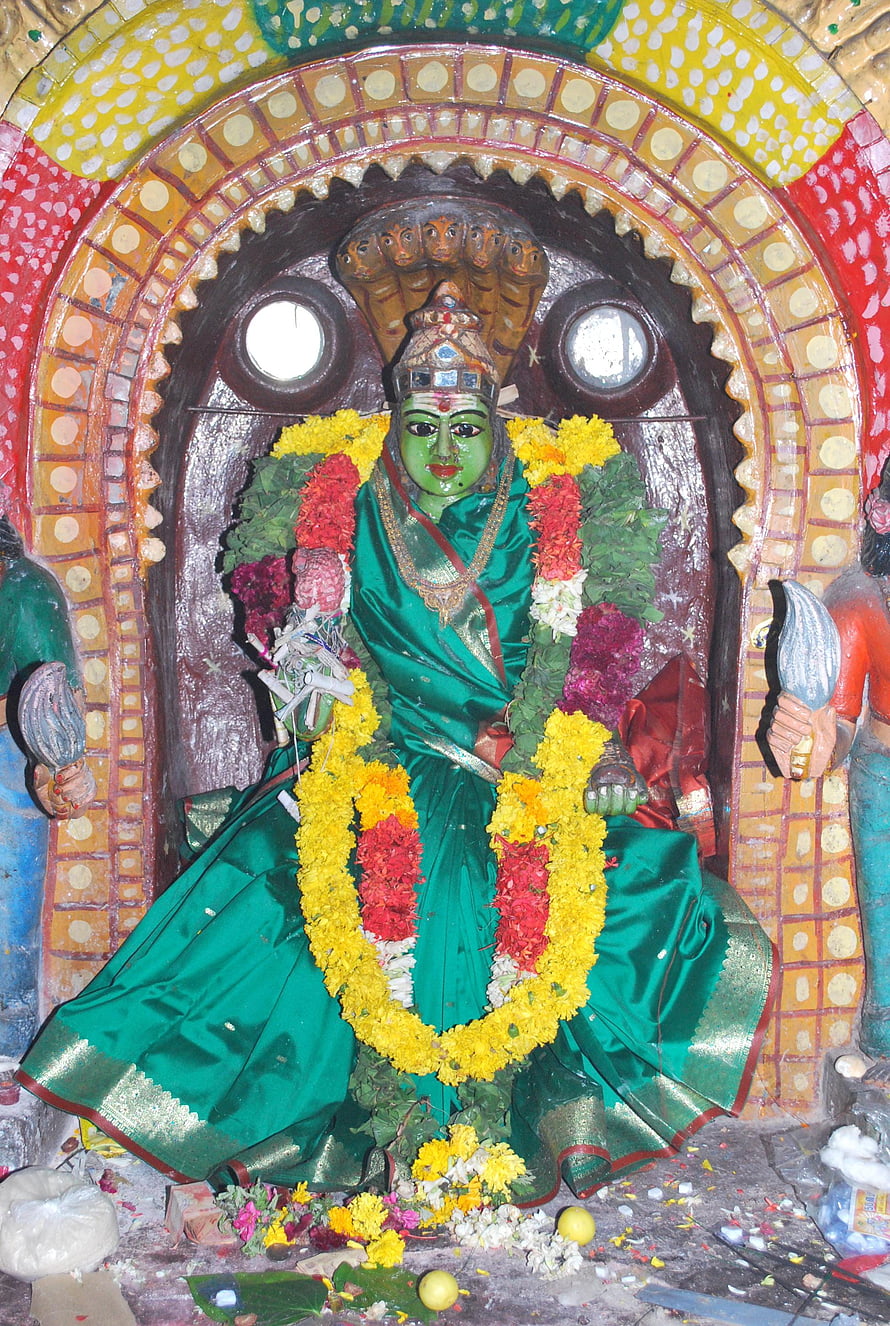 Pachaiamman Temple Deity in Green Saree with Flower Garlands and Ornate Arch HD phone wallpaper