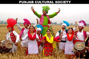 Punjabi Bhangra Dancers in Traditional Attire Performing in a Golden Wheat Field HD wallpaper