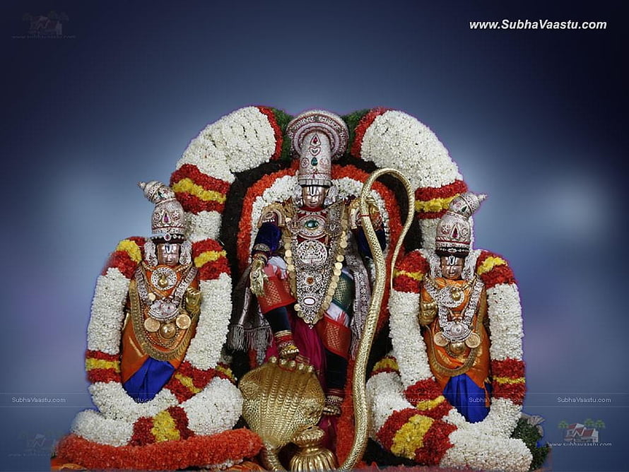 Sri Venkateswara Swamy deity adorned with vibrant flower garlands and traditional temple jewelry HD wallpaper