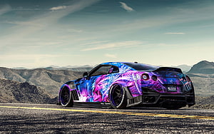 Custom Nissan GT-R with vibrant purple and blue anime wrap parked on a desert highway HD wallpaper