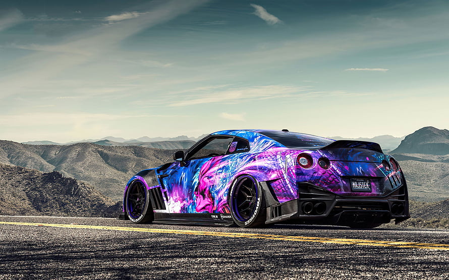 Custom Nissan GT-R with vibrant purple and blue anime wrap parked on a desert highway HD wallpaper