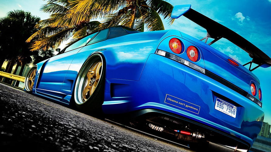 Blue Nissan Skyline GT-R R34 Stance Build With Gold Wheels and Large Rear Wing HD wallpaper