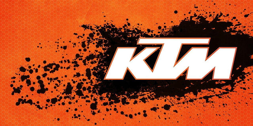 KTM Motorcycle Brand Logo on Orange Hexagonal Background with Black Ink Splatter HD wallpaper