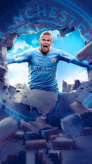 Erling Haaland Breaking Through Manchester City Wall in Sky-Blue Kit HD phone wallpaper