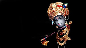 Lord Krishna Playing Flute with Ornate Crown and Jewelry on Black Background HD wallpaper