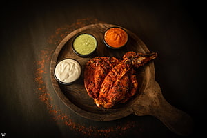 Spiced Roasted Chicken with Three Dipping Sauces on a Rustic Wooden Platter HD wallpaper
