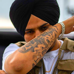 Sidhu Moosewala Portrait Wearing Black Turban and Tactical Vest with Arm Tattoo HD phone wallpaper