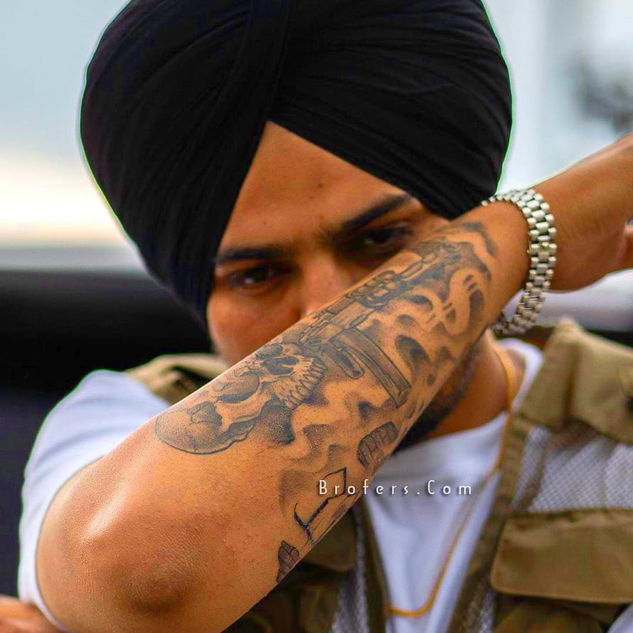 Sidhu Moosewala Portrait Wearing Black Turban and Tactical Vest with Arm Tattoo HD phone wallpaper